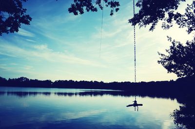 Scenic view of calm lake at sunset