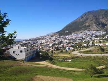 Aerial view of townscape against sky