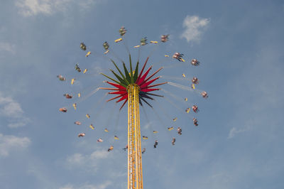 Low angle view of amusement park ride against sky