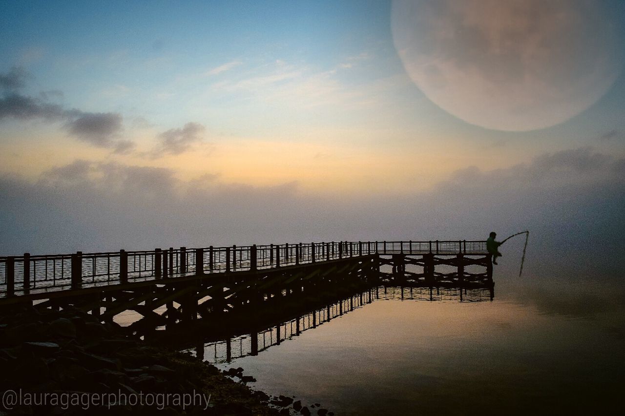 water, sky, built structure, sunset, architecture, sea, silhouette, cloud - sky, tranquility, railing, bridge - man made structure, tranquil scene, dusk, scenics, connection, nature, reflection, waterfront, pier, beauty in nature