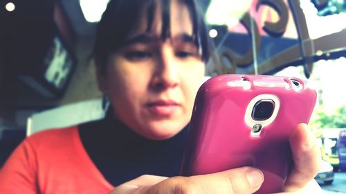 Close-up of woman using mobile phone