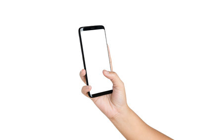 Low angle view of person using smart phone against white background