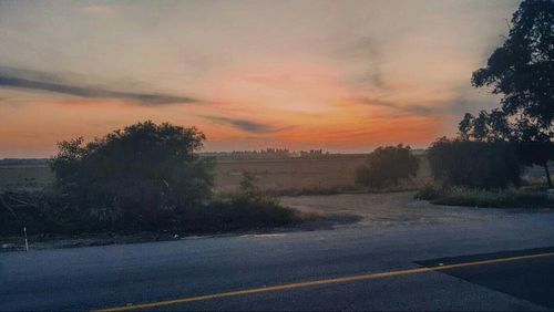 Empty road at sunset