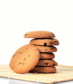 Close-up of cookies on table against white background