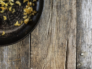 Directly above shot of pasta in cooking pan on wooden table