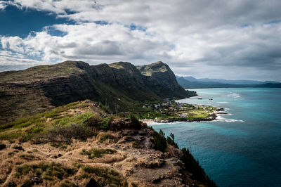 View of rocky beach against clouds