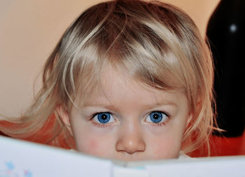 Close-up portrait of cute girl looking away