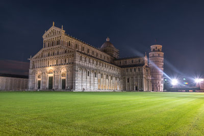 Low angle view of building lit up at night