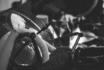 Close-up of brush by electric fan