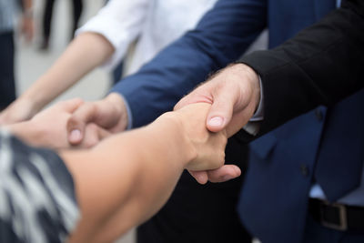 Business coworkers shaking hands in office