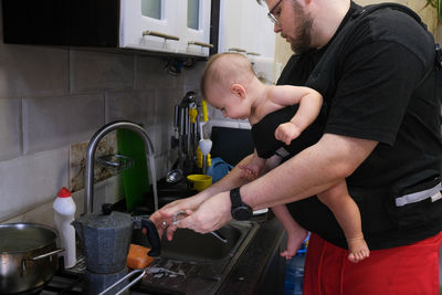 Side view of man working at workshop