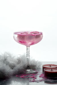 Close-up of wine glass against white background