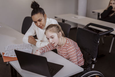 Girl on wheelchair in classroom