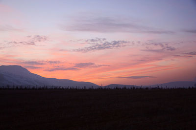 Scenic view of silhouette landscape against sky during sunset