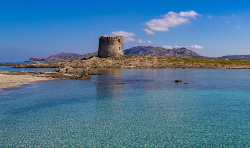 Scenic view of sea against blue sky