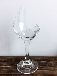 Close-up of wine glasses on table