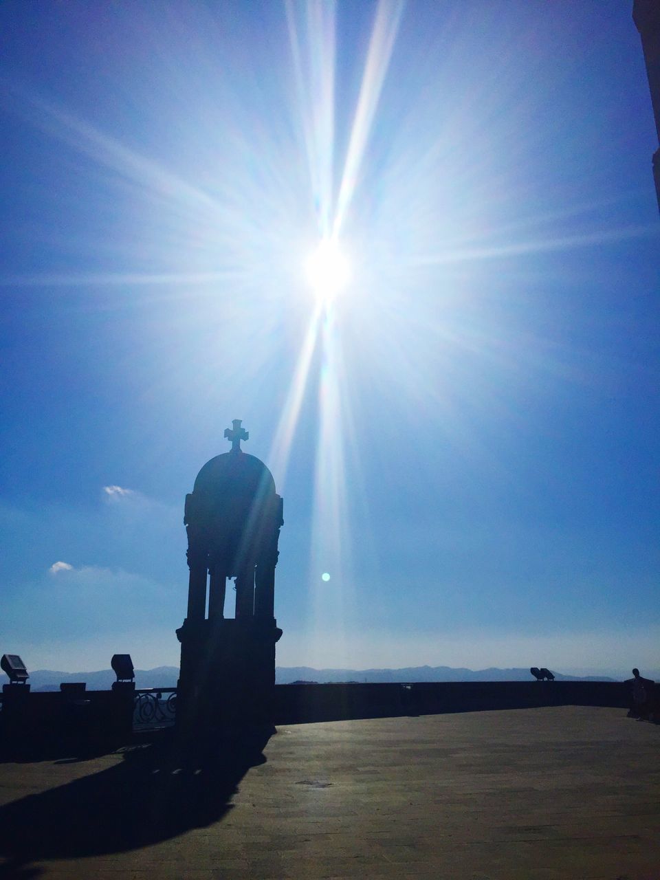 sunlight, solitude, sunbeam, sun, sunny, rear view, tranquil scene, lens flare, water, calm, relaxation, sea, clear sky, summer, tranquility, day, blue, vacations, escapism, outdoors, sky, remote, ocean, tourism