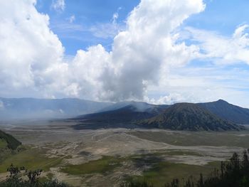 Panoramic view of volcanic landscape against cloudy sky