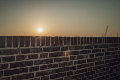 Low angle view of building against sky during sunset