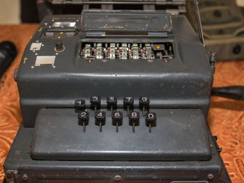 High angle view of old machinery on table