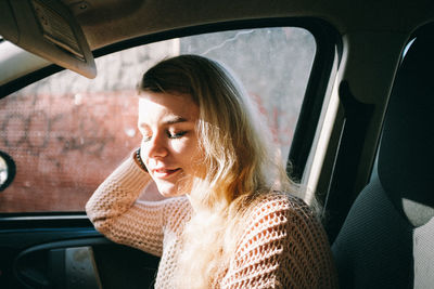 Woman sitting in car 