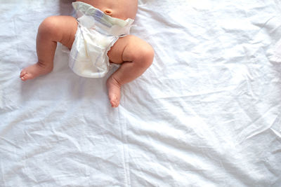 High angle view of child on bed