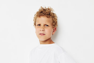 Portrait of cute girl against white background