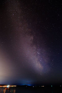 Scenic view of star field against sky at night