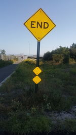 Warning sign on grass