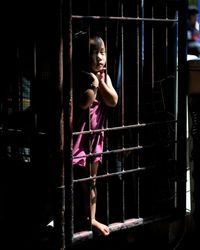 Full length of girl looking away