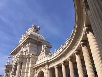 Low angle view of historical building against sky during sunny day