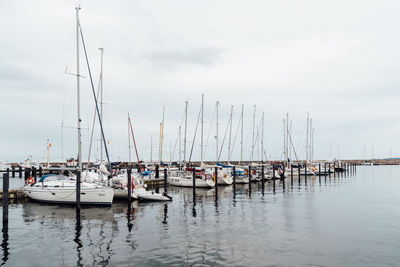 Scenic view of sailing boats moored in the harbour. sassnitz is a small town located in rugen island