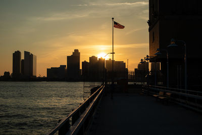 Scenic view of buildings against sky during sunset