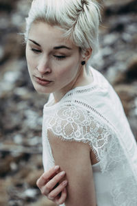 Portrait of young woman looking down