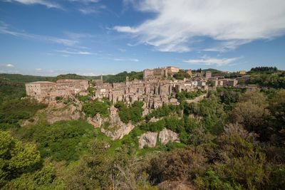 Panoramic view of historic building of sorano in tuscany against sky