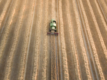 Aerial view of combine harvester on agriculture landscape