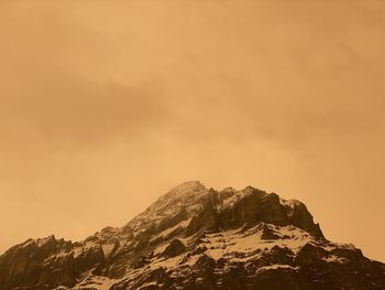 Low angle view of mountain against sky during sunset