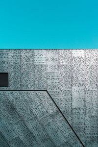 Low angle view of building against blue sky