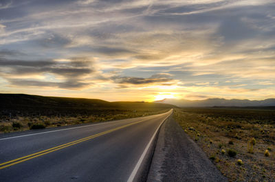 Road against sky during sunset