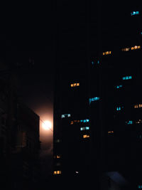 Illuminated buildings in city at night