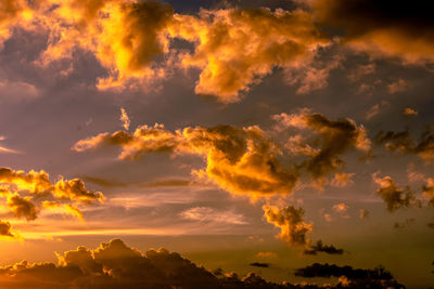 Low angle view of dramatic sky during sunset