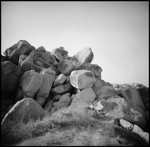 Rocks on land against clear sky