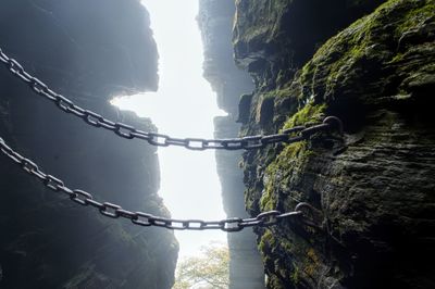 Rope on mountain against sky