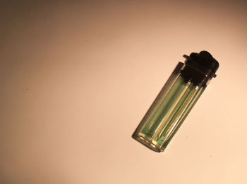 High angle view of glass bottle on table