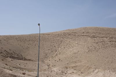 Scenic view of desert against clear sky