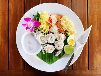 High angle view of flowers in plate on table