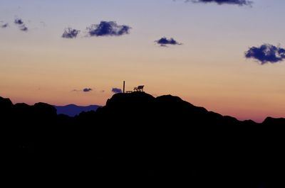 Silhouette mountain against sky during sunset