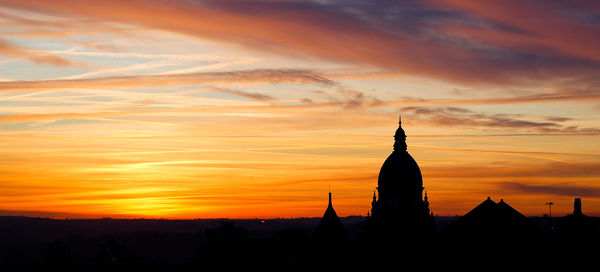 Silhouette of building at sunset