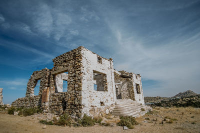 Low angle view of old ruin against sky