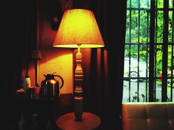 Close-up of illuminated lamp at home